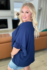 Airflow Peplum Ruffle Sleeve Top in Navy - Maple Row Boutique 
